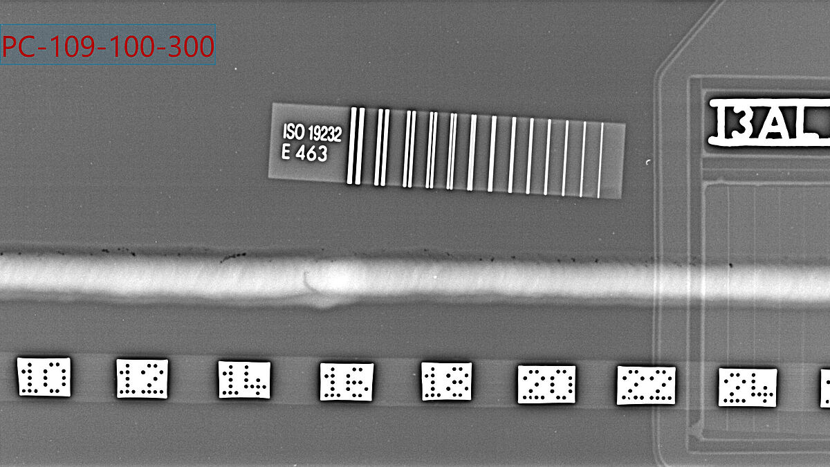 Évaluation du contrôle radiographique Aluminium en position PC – Les pores sont reconnaissables (zones sombres sur l’illustration).