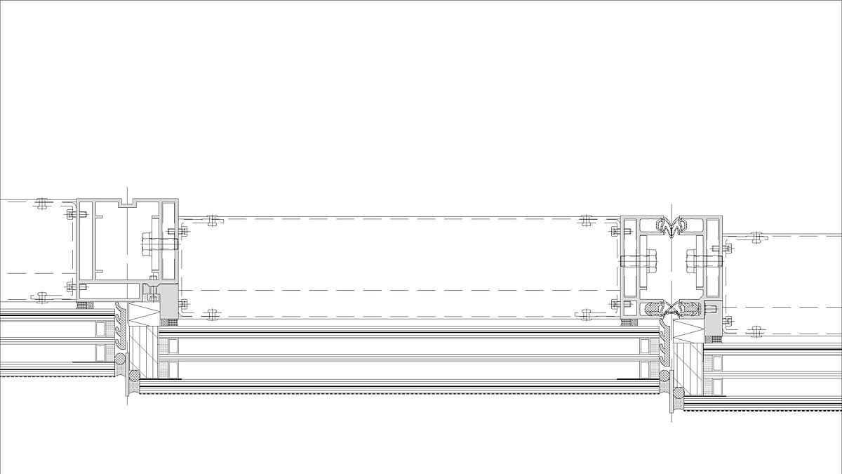 Coupe horizontale : l’enveloppe de verre à écailles à l’extérieur ainsi que les joints de profilés avec étanchéité sont bien visibles. Les profilés verticaux sont en aluminium. 