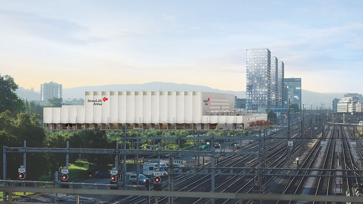 La forme cubique imposante de la Swiss Life Arena de Zurich-Altstetten marque de son empreinte l’espace urbain peu aménagé entre la voie ferrée et l’autoroute.Photo : Caruso St John Architects